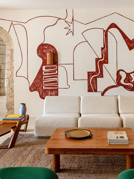 Luxurious living room with plush couch, elegant coffee table, and captivating wall art.